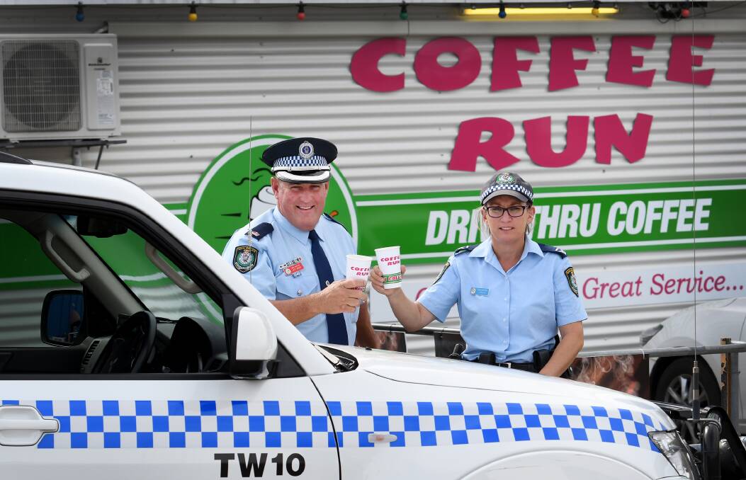 Coffee with a cop: Tamworth officer-in-charge Chief Inspector Jeff Budd and crime prevention officer Senior Constable Jen Ridley are ready to shout coffee on Tuesday morning in Tamworth. Photo: Gareth Gardner