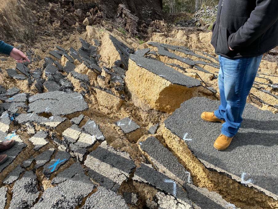 Upper Hunter Shire Council general manager Greg McDonald stands near deep cracks in the roadway in 2021. Picture supplied