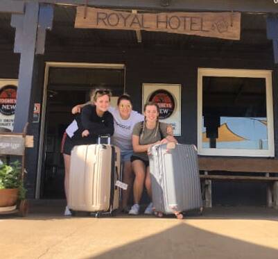 Brit Ele, centre, with the two Irish backpackers who had not long arrived at the Spring Rigde pub. Photo: supplied