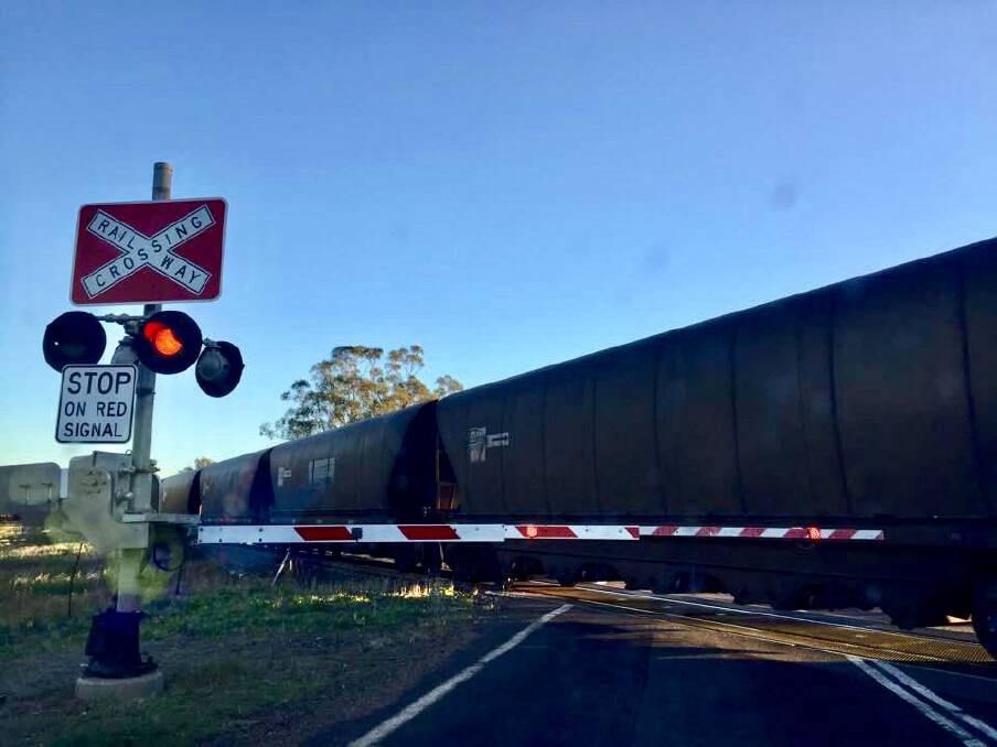 A train races through the railway crossing near the Curlewis turn-off on the Kamilaroi Highway. The speed limit approaching the crossing will be reduced from 100km/h to 80km/h.