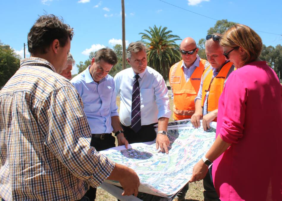 Checking out a detailed design of Gunnedah's rail overpass project. Pictured on Friday are Roads and Maritime Services' Andrew Mula, deputy mayor Rob Hooke, Tamworth MP Kevin Anderson, mayor Jamie Chaffey, Daracon's Adam King and Simon Flannery, and Minister for Roads, Maritime and Freight Melinda Pavey.