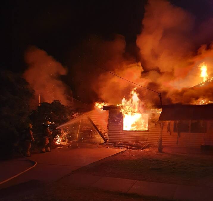 The home in Conadilly Street was ablaze when firefighters arrived in the early hours of this morning. Photo: FRNSW