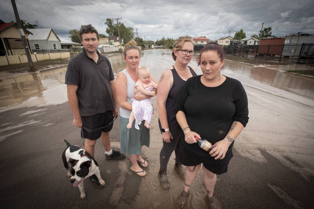 Dion Betts and Lauren Mackley with their daughter Violet and fellow Gunnedah flood victims Kristy Gordon and Amelia Williams in late 2021. Photo: Peter Hardin