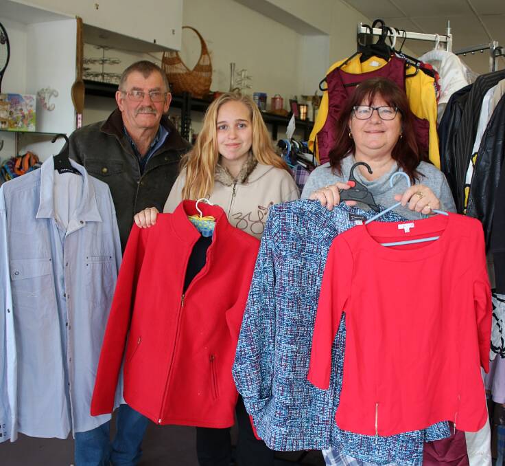 OPEN FOR BUSINESS: Harvest's Wayne Nichols, Shelly McBride and Glenda Sellwood at the op shop's new location on George Street in Quirindi. 
