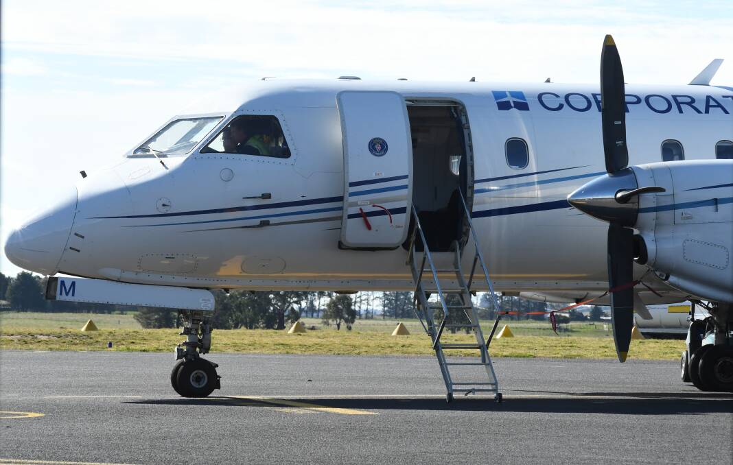 LIGHT LOAD: The Fly Corporate/Link Airways flight after landing in Orange from Melbourne on Tuesday. Photo: JUDE KEOGH