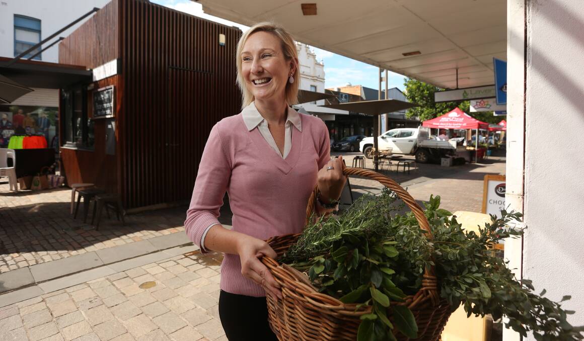 VEGGIE FOCUS: Dietician Nicole Barber at the Slow Food Earth Market Maitland in The Levee with a basket of herbs. Picture: Simone De Peak