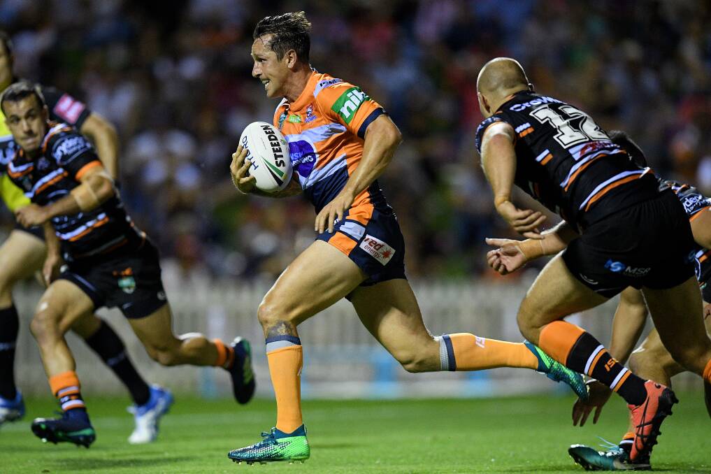 TRY TIME: Knights skipper Mitchell Pearce sets sail for the line. Picture: AAP