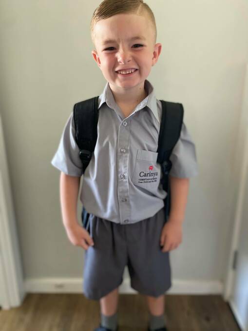 EAR TO EAR: Ashton Hawley wants to be a policeman when he grows up, and took his first educational steps on Wednesday. Photo: Supplied