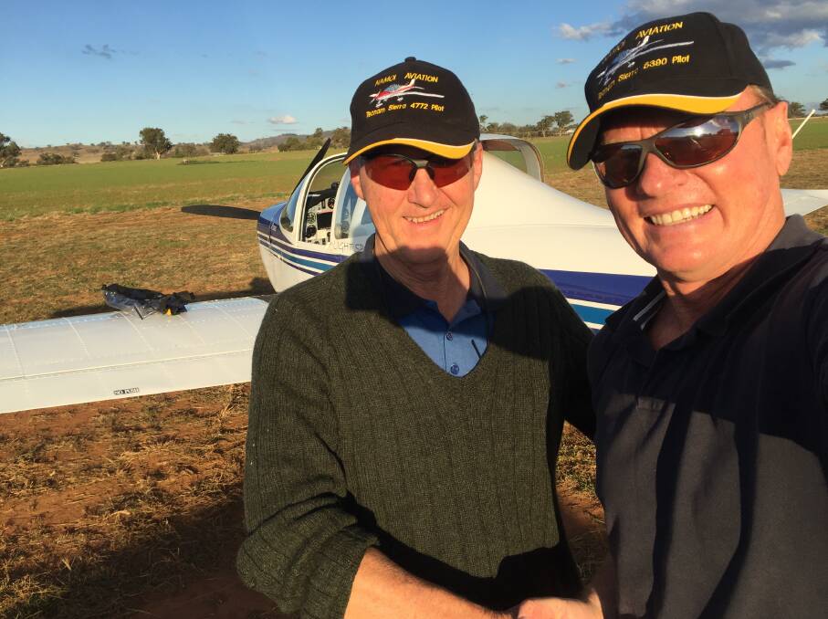 FIRST FLIGHT: Manilla's paragliding world record breaker Godfrey Wenness with Namoi Aviation instructor Ken Flower were the first to fly an ultra-light aircraft from Manilla and land in Sydney International Airport. Photo: Supplied