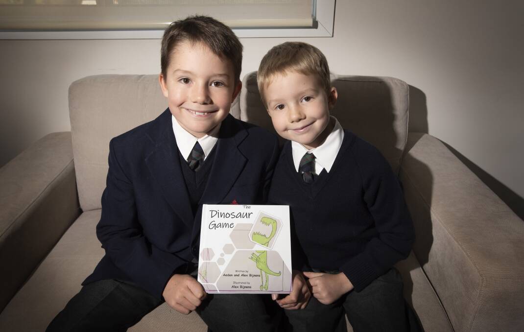 BROTHERS: Aedan and Alex Bijnens wrote and illustrated a book during isolation, with copies printed off gracing Calrossy Anglican School's library shelves. Photo: Peter Hardin