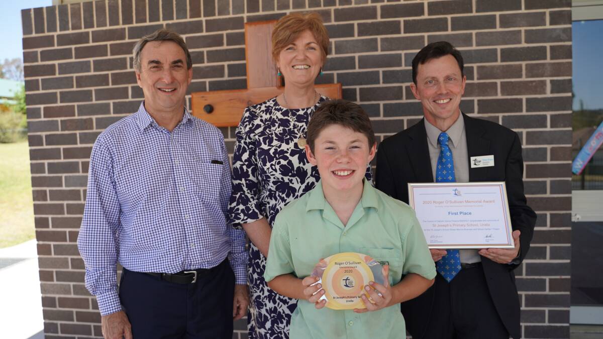  CHUFFED: Director of Schools Chris Smyth, principal Judy Elks, CCSP NSW/ACT executive director Peter Grace with CEO of the Sheep Manure Business Malakye, proudly holding the trophy for the state-wide win. Photo: Supplied