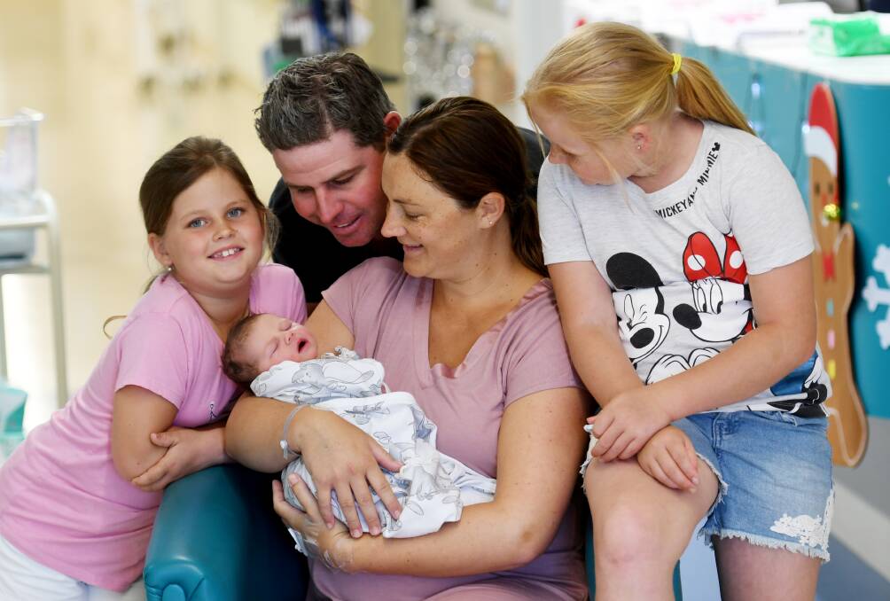 LOVE: Maddison and Matt Edwards with mum Sarah Dowell Hallee Louise and Savanah Edwards welcomed Hallee Louise at 1.21am, New Year's Day. Photo: Gareth Gardner
