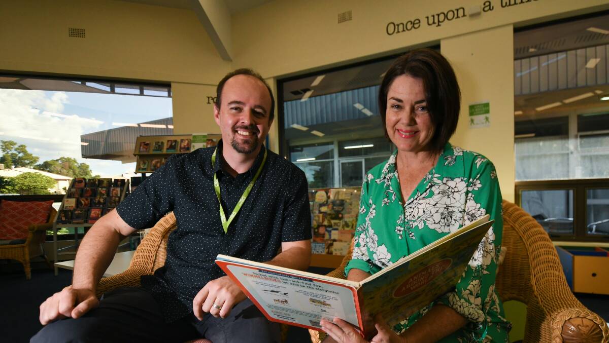 Manager BOOK BONANZA: Jonathon Stilts and Kelly Makepeace from Tamworth City Library have been astounded at the participation they've witnessed online. Photo: Gareth Gardner
