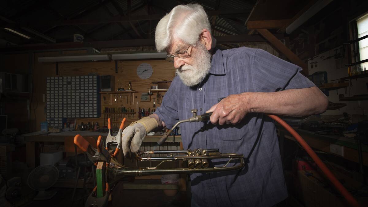 FLAME: Tamworth's musical instrument repairer Tom Chapman is a master of his art and doesn't have any plans to quit. Photo: Peter Hardin