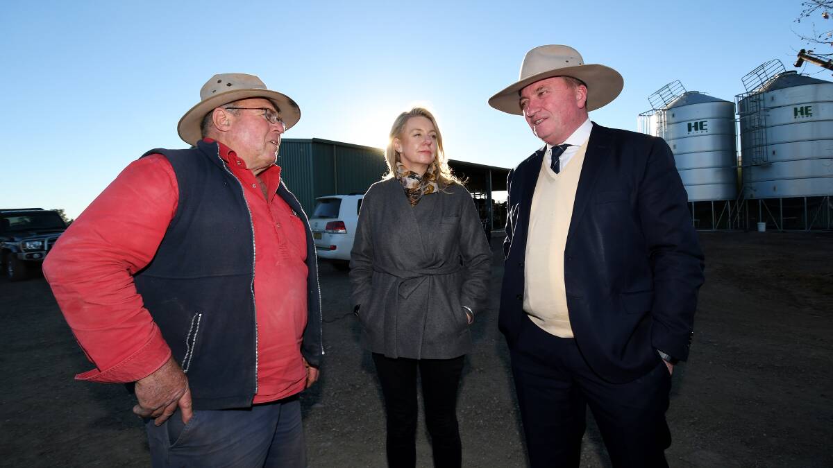 ON THE GROUND: Tamworth dairy farmer Wes Brown chats with Senator Bridget McKenzie and New England MP Barnaby Joyce on Friday. Photo: Gareth Gardner 
