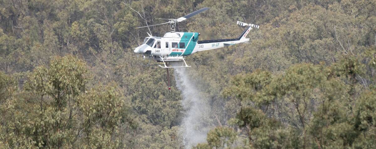 BIG EFFORT: Crews on the ground and from the air helped to contain the blaze near Coonabarabran. Photo: File photo 