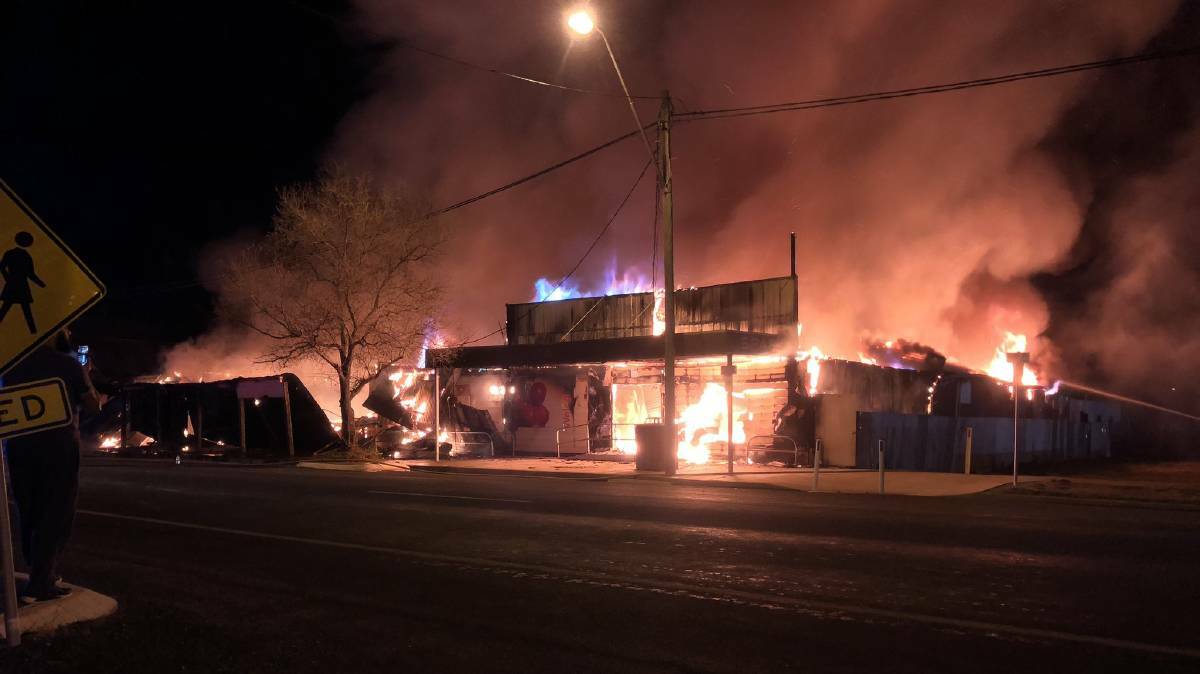 The fire which destroyed three shops along Mungindi's main street on September 1 last year. Photo: Screenshot from a video taken by Jarrod Hickling, Facebook 