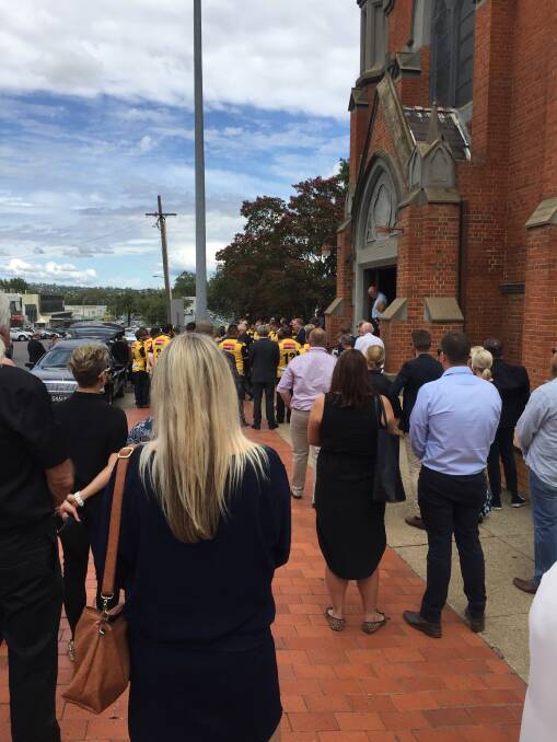 FITTING FAREWELL: Hundreds of family and friends gathered at St Nicholas Catholic Church to pay their respects to Pirates legend Graham Yeo, with a guard of honour formed by past and present players outside on Wednesday.