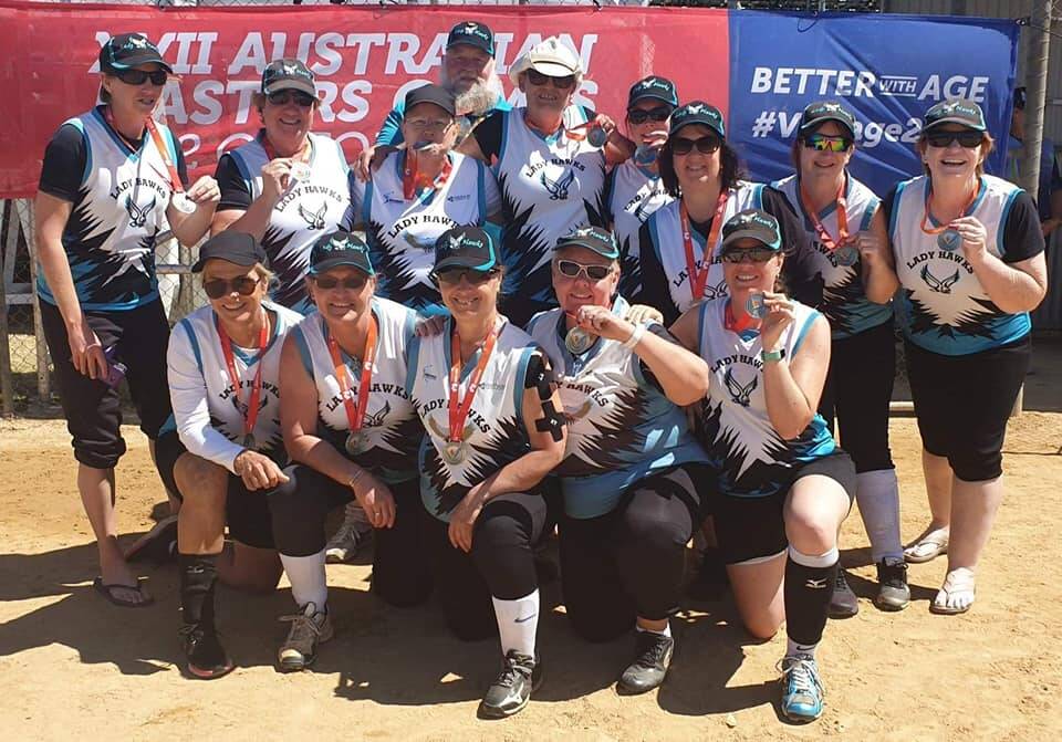 SILVER LINING: The Lady Hawks celebrate their silver-medal finish at the Australian Masters Games in Adelaide. Photo: Supplied 