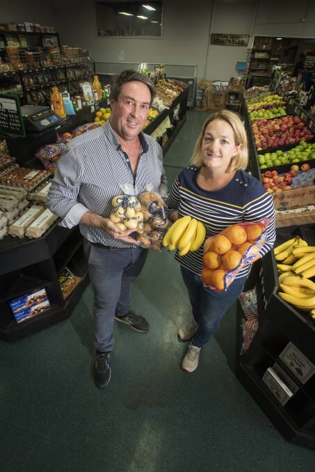 KEEPING UP: Farmer Bob's owners Brendon and Vicki North have been kept busy by the high demand for fresh produce. Photo: Peter Hardin 180320PHF010