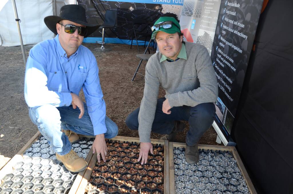 CUTTING EDGE: Geohex sales manager Josh Lewis demonstrates the new technology at the Gunnedah Landmark stand during AgQuip. Photo: Billy Jupp 