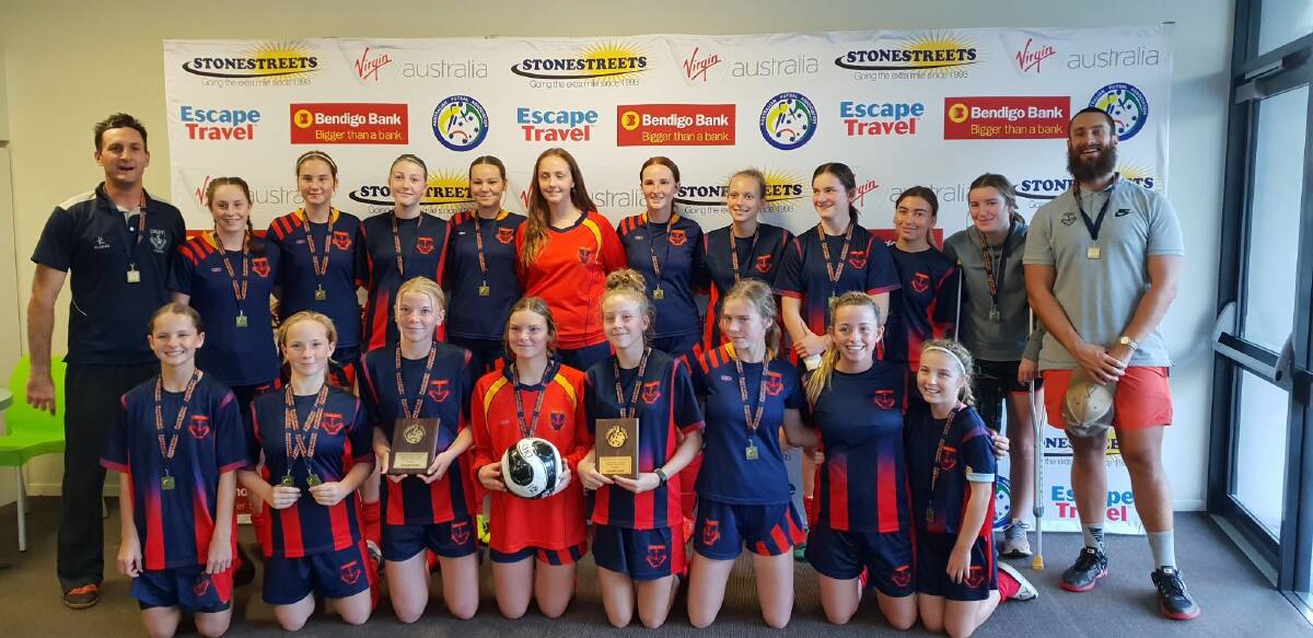 TOP EFFORT: The Oxley High School girl's futsal teams celebrate their success at Coffs Harbour. Photo: Supplied 