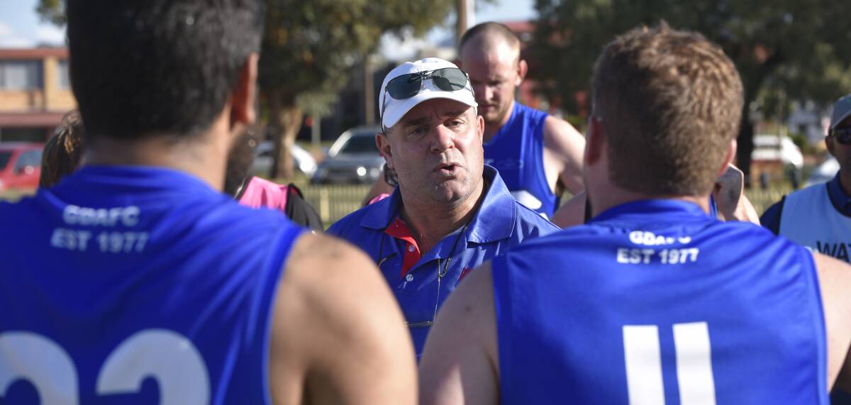 FRESH FACE: New Gunnedah Bulldogs coach Doug Meagher addresses his troops at quarter time. Photo: Billy Jupp 