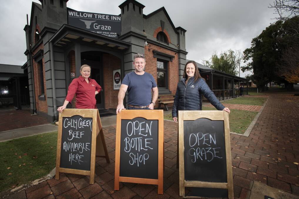 THROW OPEN THE DOORS: Graze Willow Tree Inn's Sonia Marshman, Sam Hanna and Katrina Mantell are ready to welcome back visitors from June 1. Photo: Peter Hardin 210520PHB013 