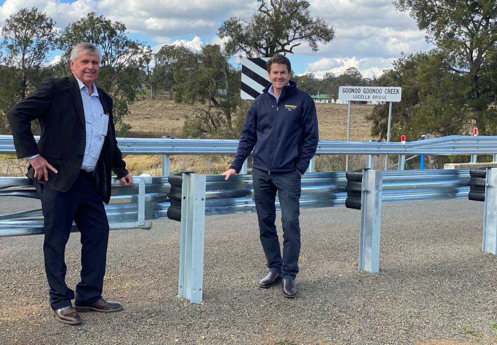 WELCOME UPGRADE: Tamworth deputy mayor Phil Betts and Tamworth MP Kevin Anderson mark the completion of works on Garoo Road. Photo: Supplied 