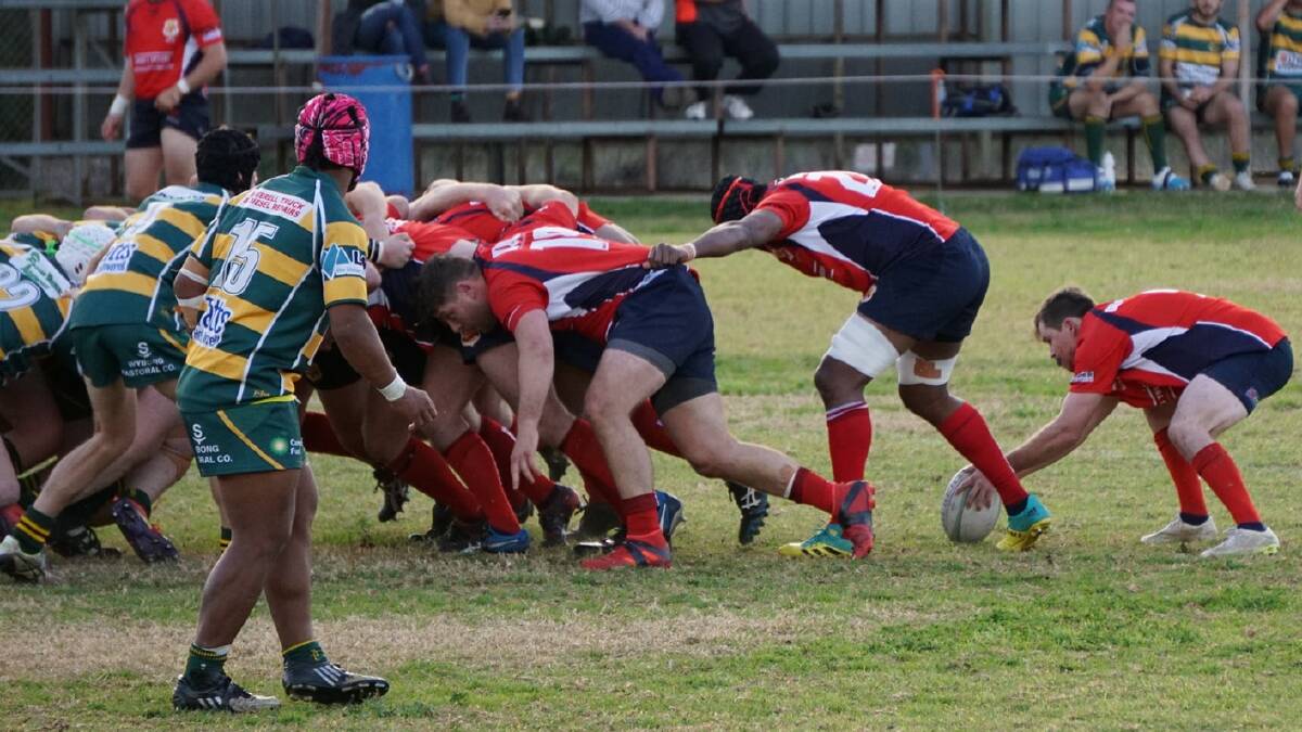 PAYBACK: Red Devils' Darren Morrison looks to retrive the ball during his side's 43-point victory over the Inverell Highlanders. Photo: Supplied 