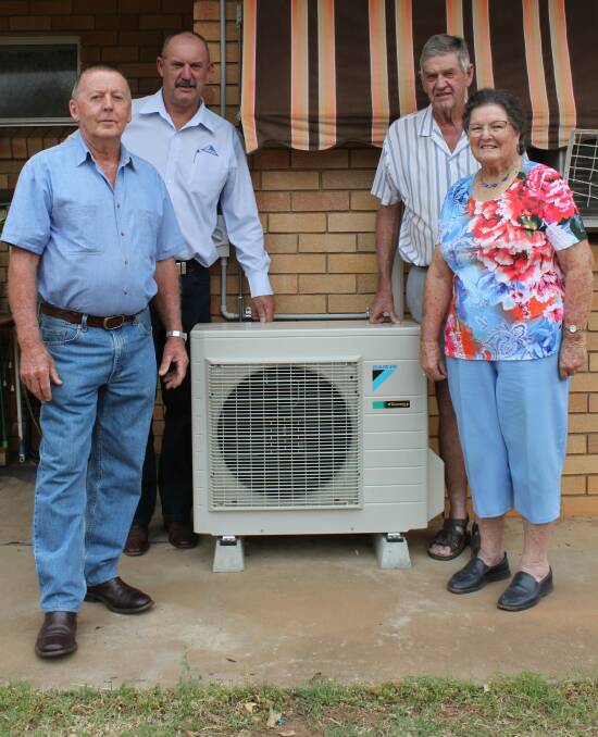 COOLING DOWN: David Grover, Darren Swain, Ron Boxsell and May Boxsell celebrate the donation of new air conditioning units. Photo: Supplied 