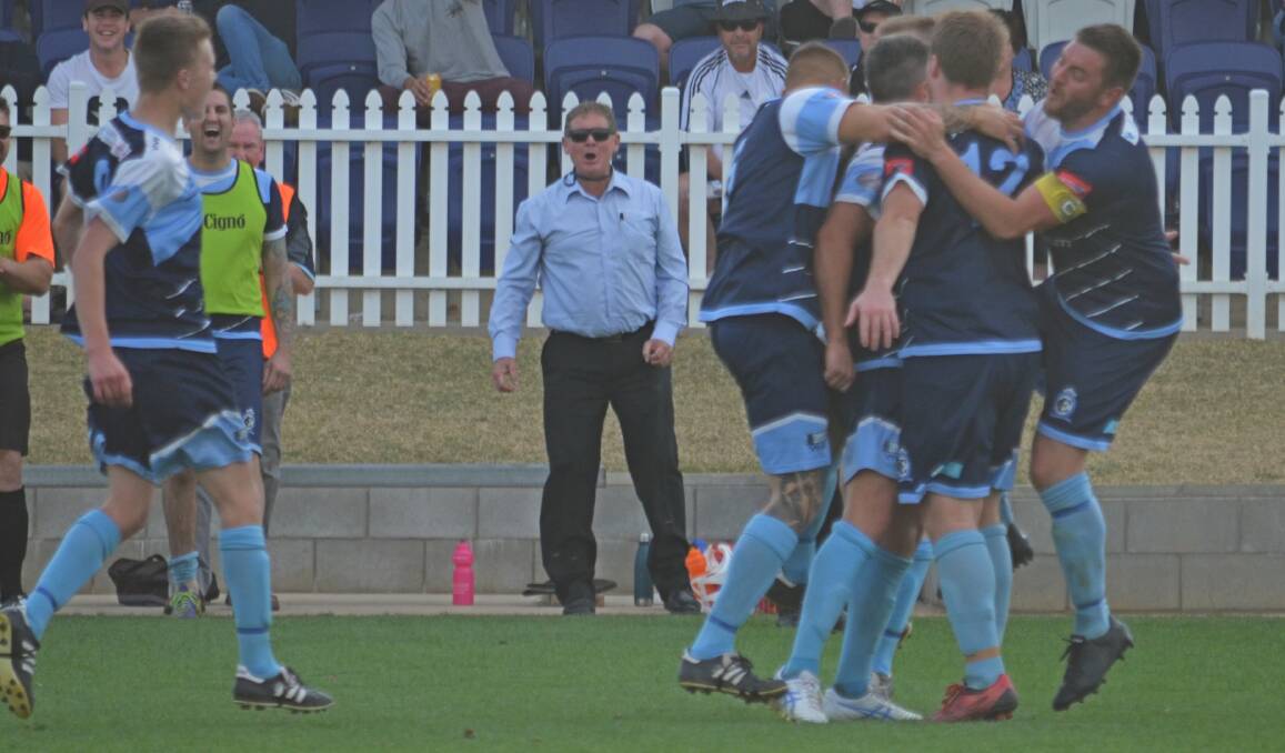 PERFECT TIMING: Greg Bartlett (behind) has opted to step down as coach of Tamworth FC after winning this season's Premier League title. Photo: Billy Jupp 