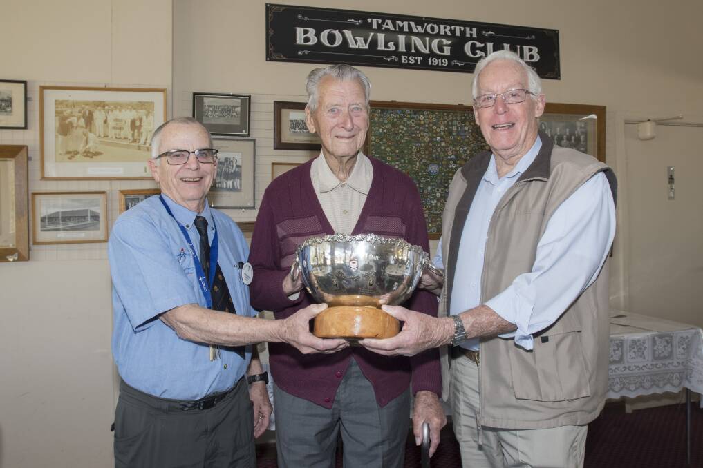 ON A ROLL: Greg Roese, Nevell McDonald and Keith Stevenson proudly show off the newly revitalised Diggers Cup trophy at Tamworth City Bowling Club. Photo: Peter Hardin 130919PHC011 
