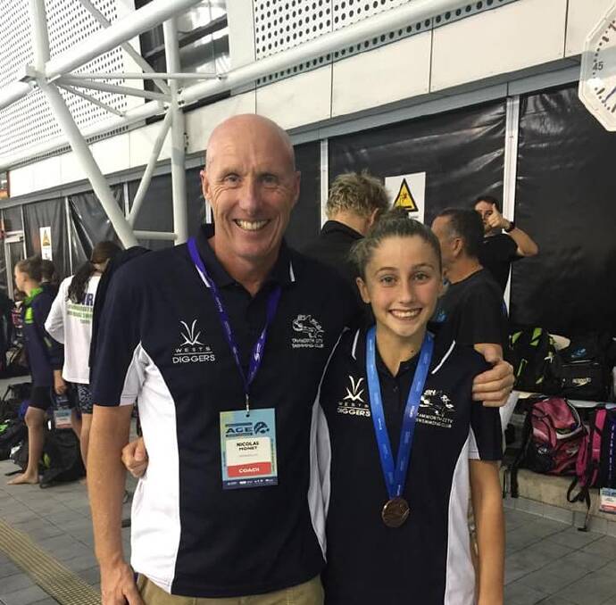 TOP EFFORT: Alex Hayes celebrates her bronze medal performance with coach Nick Monet. Photo: Supplied 