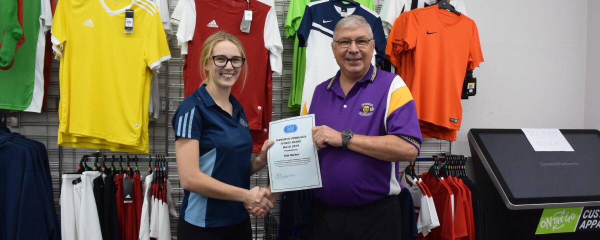 TOP HONOUR: Alix Sills presents Robert Barber with the Sportsmans Warehouse community sports award for April. Photo: Samantha Newsam 