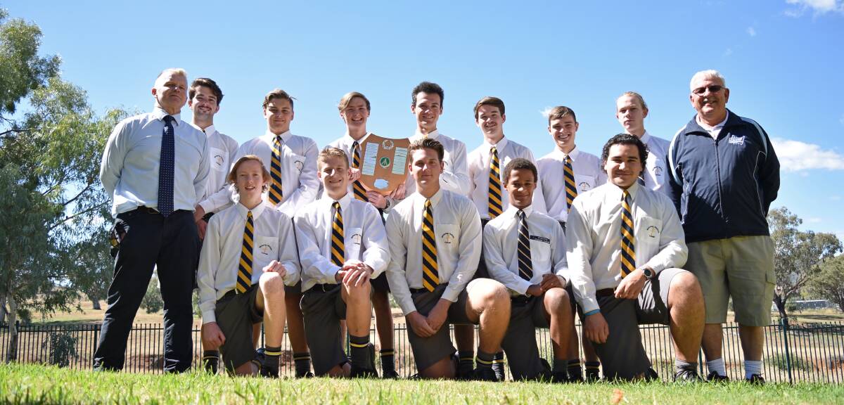BIG WIN: The McCarthy Catholic College cricket team celebrate a successful cricket season by showing off their newly-won Ron George Shield. Photo: Ben Jaffrey 20190410BJ01 