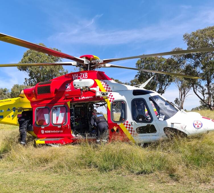 HELPING HAND: The Westpac Rescue Helicopter Services wasted little time helping Ana after arriving at her family's Woolbrook property on Monday. Photo: Tania Haling