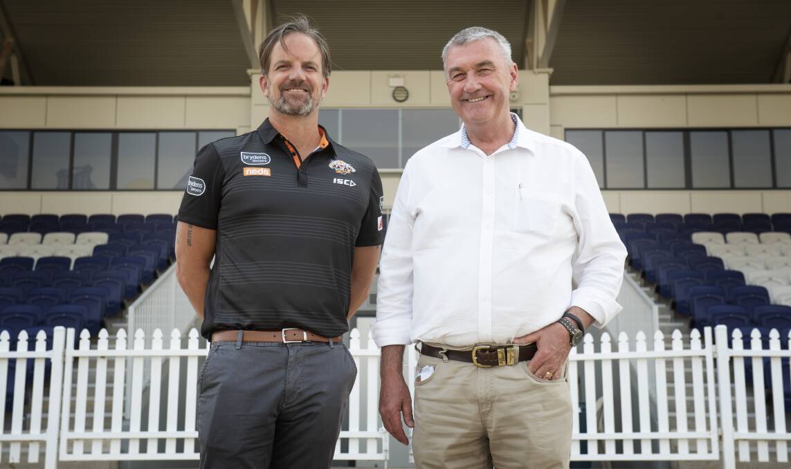 STRONG BOND: Wests Tigers' Justin Pascoe and Wests Entertainment Group's Rod Lang are ready for next year's game. Photo: Peter Hardin 
