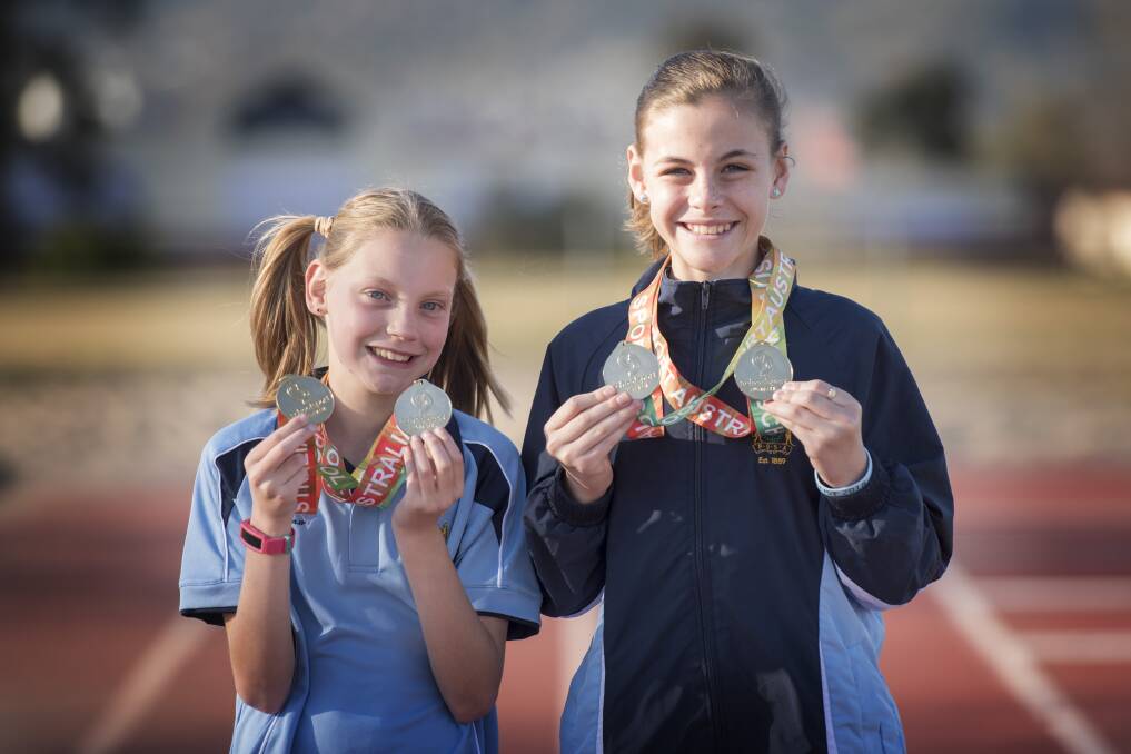 GOLD RUSH: Tamworth's Abbie Peet and Isabella Wall celebrate their recent success. Photo: Peter Hardin 290819PHF005 