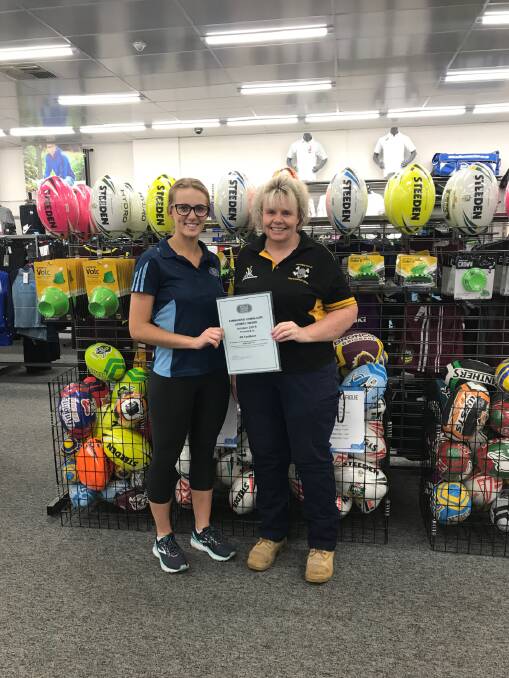 TOP HONOUR: Alix Sills presents Tamworth Pirates member Ali Faulkner with the October Sportsmans Warehouse Community Sports Award. Photo: Supplied 