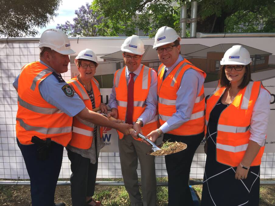 TEAM EFFORT: Jeff Budd, Gae Swain, Kevin Anderson, Troy Grant and Sarah Mitchell turn the first sod on the Gunnedah Police Station upgrade. Photo: Billy Jupp