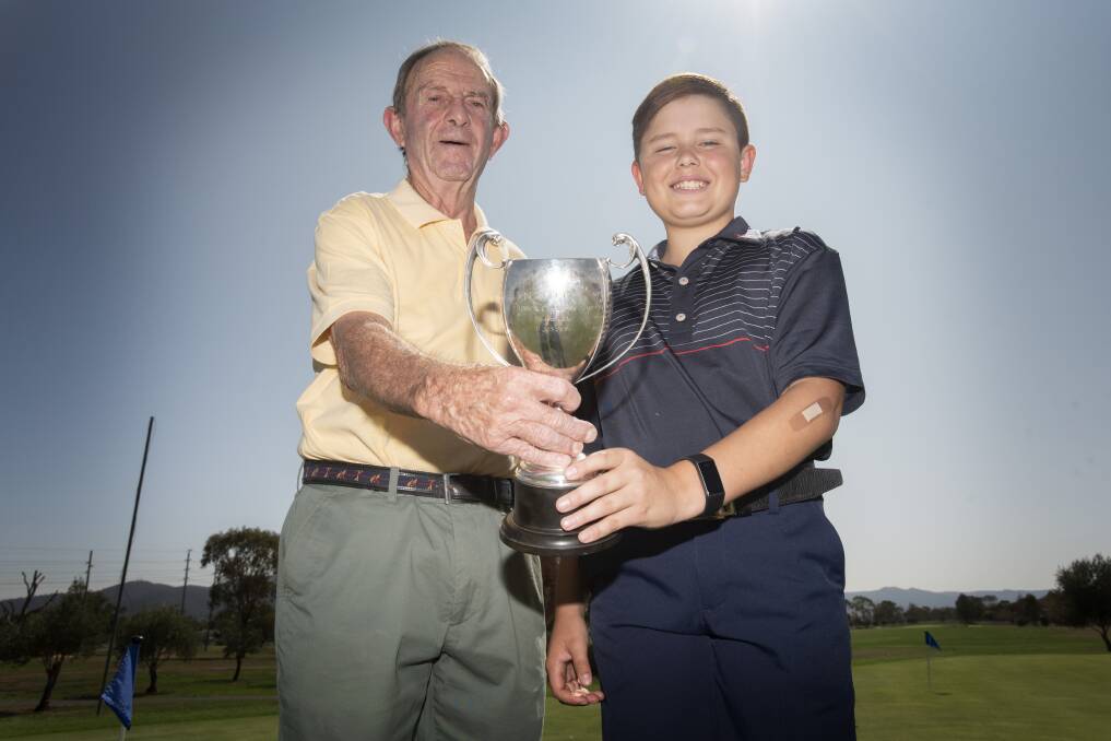 PASSING OF THE TORCH: Inaugural Northern Districts Junior Champion Tony Fogarty celebrates the victory of 11-year-old Oliver Thomas. Photo: Peter Hardin 220120PHA008 