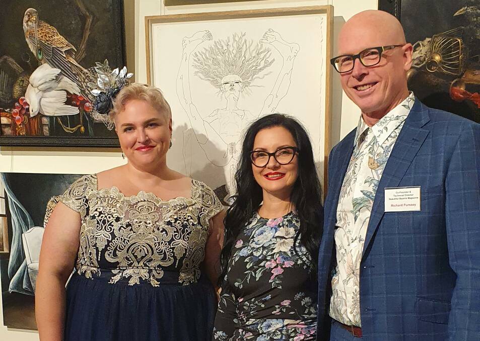 BRIGHT, BEAUTIFUL AND BIZARRE: Danijela Krha Purssey with her husband Richard and NERAM director Rachel Parsons at the opening of her current exhibition - Interconnected . Picture: supplied.