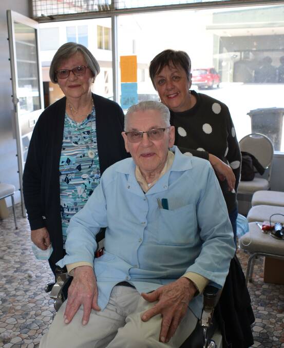 LAST DAY ON THE JOB: Lillian and Roy Cowley with Robyn O'Neill - one of their three daughters. Photo: Vanessa Arundale.