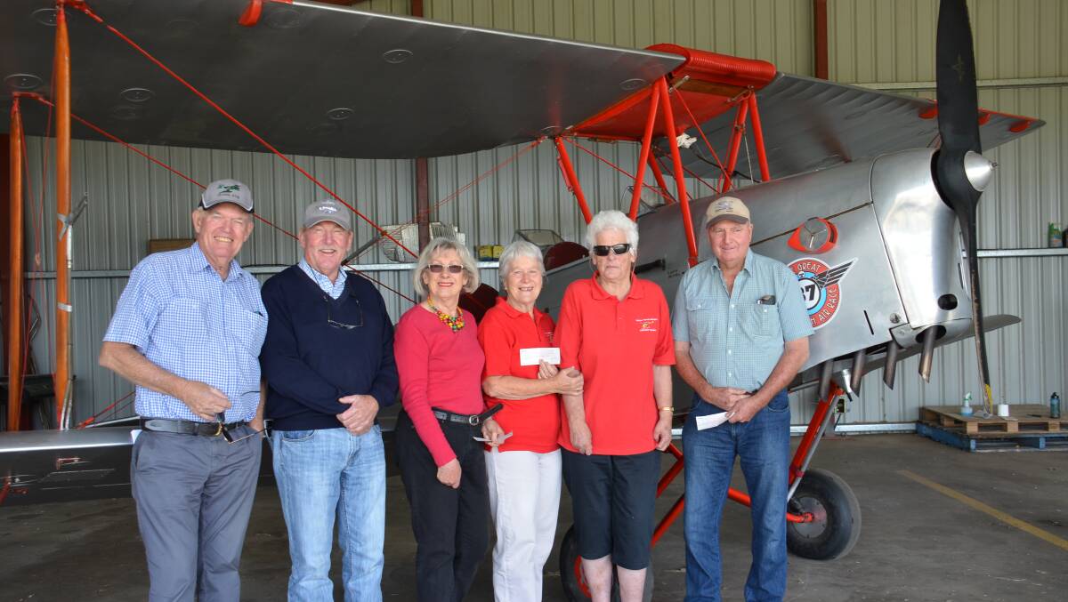 Walcha Aero Club outgoing president Mike Faulkner, incoming president Stephen Lisle, Walcha Support Group president Carolyn Salter, Westpac Helicopter Rescue support group members Olive Chandler and Hazel Cameron and Lions Club treasurer John Wark at the Walcha Aerodrome last week