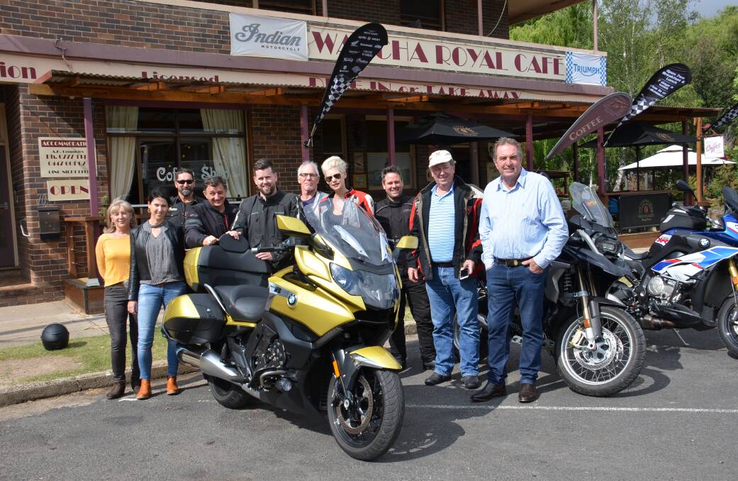 MOTORBIKE MECCA: Brad Keable and Toni Heaney from the Walcha Royal Cafe with Walcha Tourism manager Susie Crawford, Walcha mayor Eric Noakes and the BMW famil group.