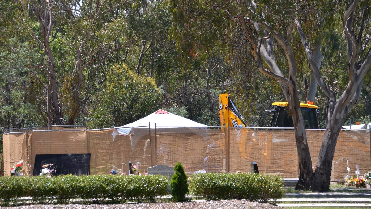The scene at the grave of Lewis 'Buddy' Kelly in Armidale Cemetery on Tuesday.