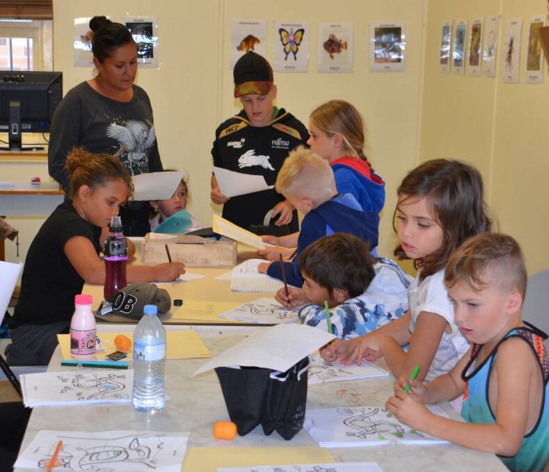 Reggae Towney conducts a Dunghutti language class at the Amaroo office every Friday.