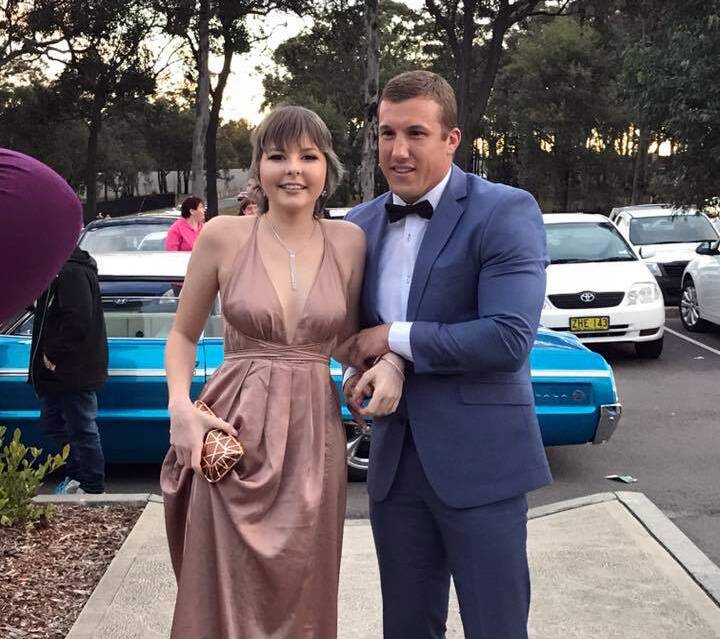 TOUCHING: Hannah Rye being accompanied by former Knights player Trent Hodkinson to her school formal.