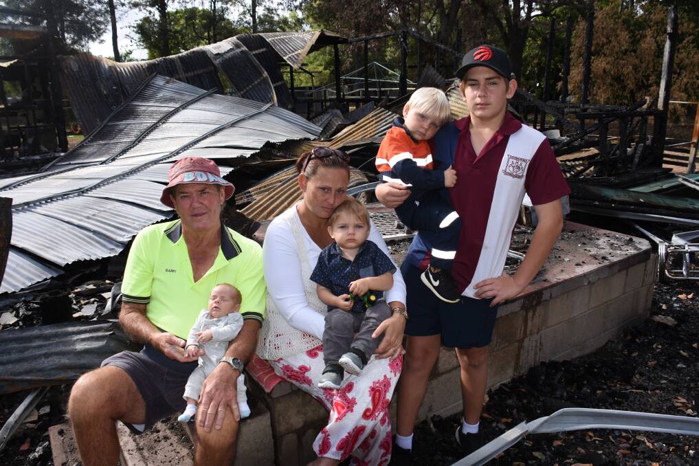 Friend and home owner Gary Roberts with Lynda Dean and children, Harry, six-weeks, Clancy, 1, William, 2, and John, 15.